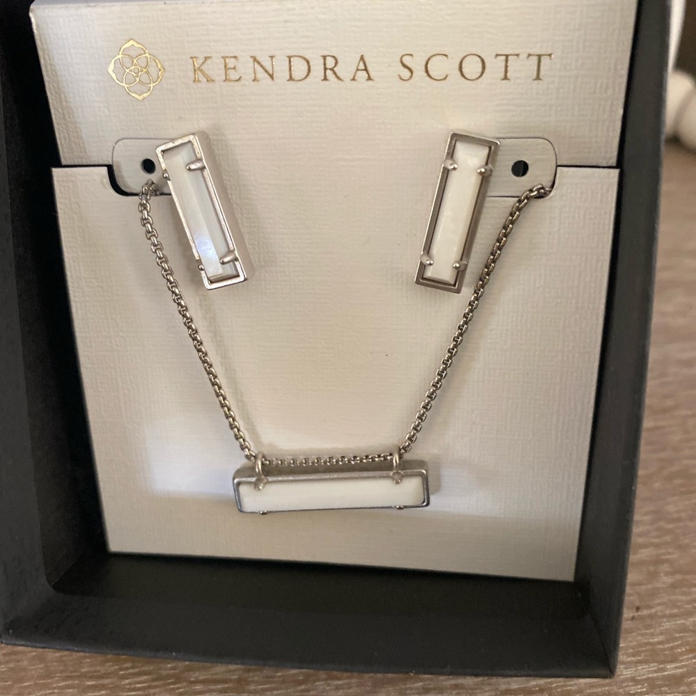 Authentic Kendra Scott earrings with matching necklace.  White pendant bar style